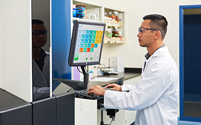 A laboratory technician operating the Growth Direct® System, showcasing trusted automation that frees up analyst time and standardizes workflow. A laboratory technician operating the Growth Direct® System, showcasing trusted automation that frees up analyst time and standardizes workflow.