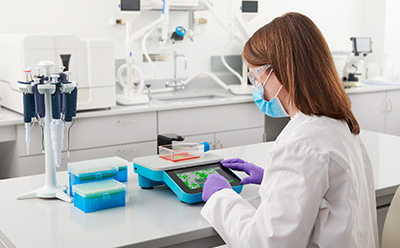 Millicell® DCI Digital Cell Imager for cell culture analysis Scientist monitoring cells using the Millicell<sup>®</sup> DCI