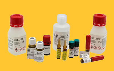 Reference Materials Sampling of several bottles and vials of Certified Reference Materials (CRMs) for testing and research.
