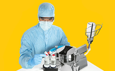 Sterility Testing Consumables, Media & Instruments Scientist using Steritest to ensure sterilized product before going to market.