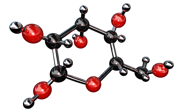 The image displays a 3D molecular model with black and red spheres representing atoms, connected by rods to illustrate chemical bonds. The black spheres are smaller and likely depict carbon atoms, while the red spheres could represent oxygen atoms, suggesting an organic compound. 