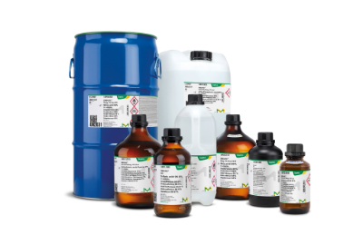 Acids A collection of chemical containers, including a blue drum, a white jerrycan, and several brown glass bottles, all labelled with safety information and branding from Supelco.