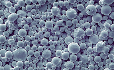 A close-up view of powder particles used for 3D printing, captured with an electron microscope.