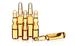 The image show a collection of five small glass ampoules containing a golden-yellow liquid. The image show a collection of five small glass ampoules containing a golden-yellow liquid.