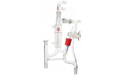 Photo of custom chemistry glassware including glass tubing, stopcocks, fittings, and the reaction vessel