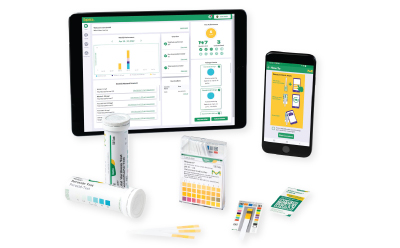 Image shows the packaging boxes of MQuant® Test Strips, the universal reference card, and two devices displaying the MQuant® StripScan App running Image shows the packaging boxes of MQuant® Test Strips, the universal reference card, and two devices displaying the MQuant® StripScan App running