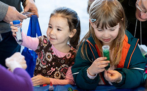 Discovery World Discovery World girl holding flask
