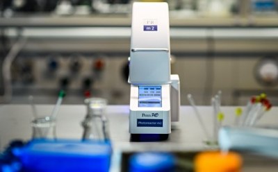 Photoreactor in organic synthesis lab for photoredox catalysis.