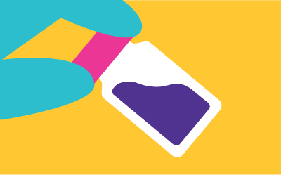 Filled glass vial held in fingertips