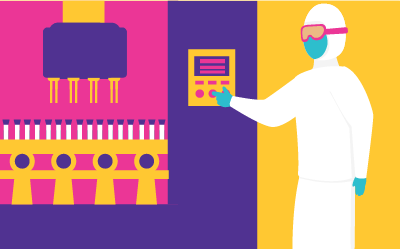 A worker wearing full PPE pressing a button on a bioreactor.