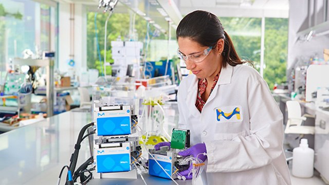 Scientist at a lab table