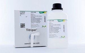 White bottle with black cap and green/yellow Supelco® branding and white packaging box of Titripac® titration reagent shown. Box has white L-shaped dispenser cap attached.