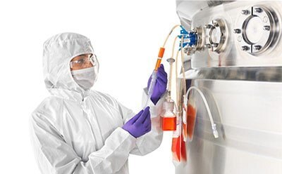 Operator taking sterile samples with NovaSeptum® GO sterile sampling system in a stainless-steel bioreactor