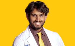 Zarrar Nashman headshot on a vibrant yellow background