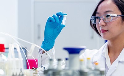 Operator holding a Eppendorf® tube 