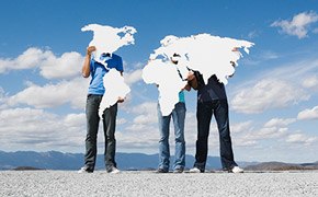 One scientist explaining new innovation to another scientist in front of a blue window